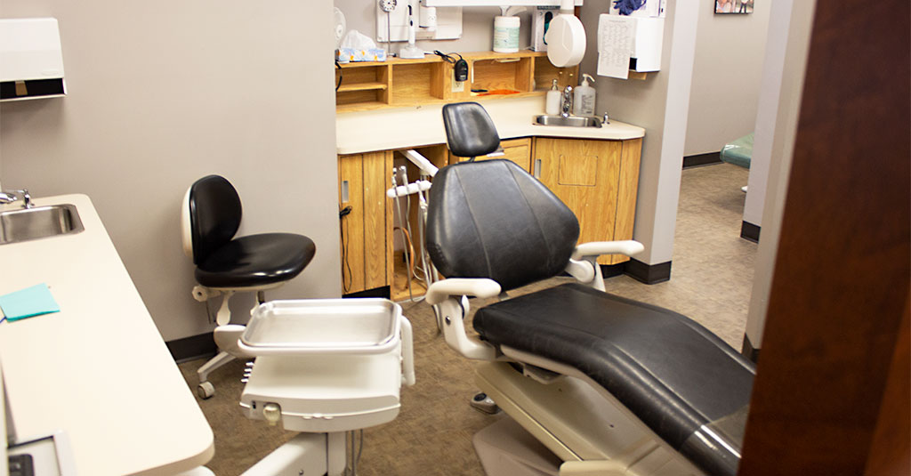 Relaxed adult patient watching TV during a comfortable dental visit