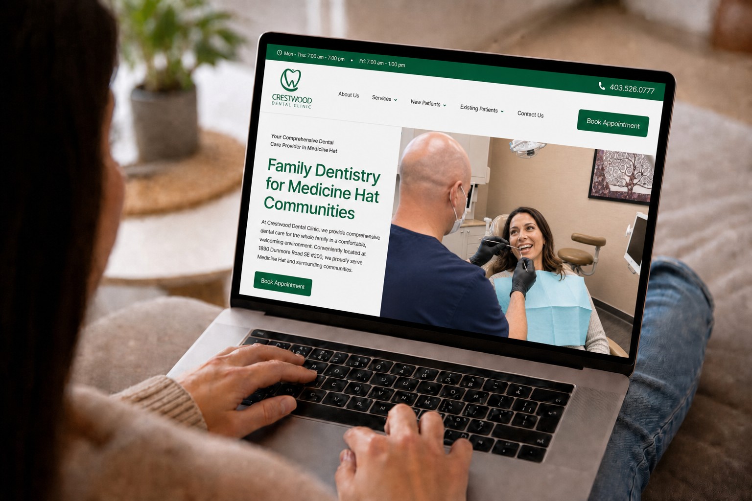 Person browsing the new Hill Top Dental Group homepage on a laptop