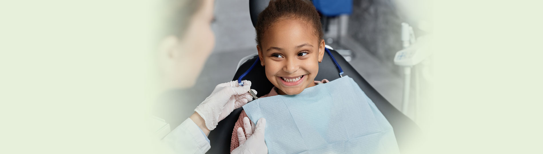 Young patient receiving a gentle dental exam at Hill Top Dental Group