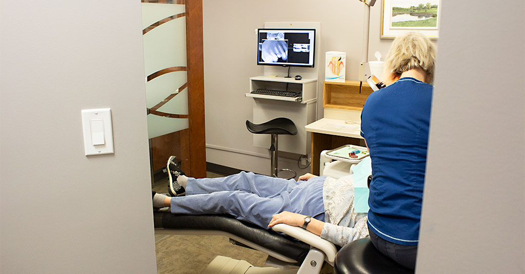 Dentist providing urgent care for a patient in dental pain