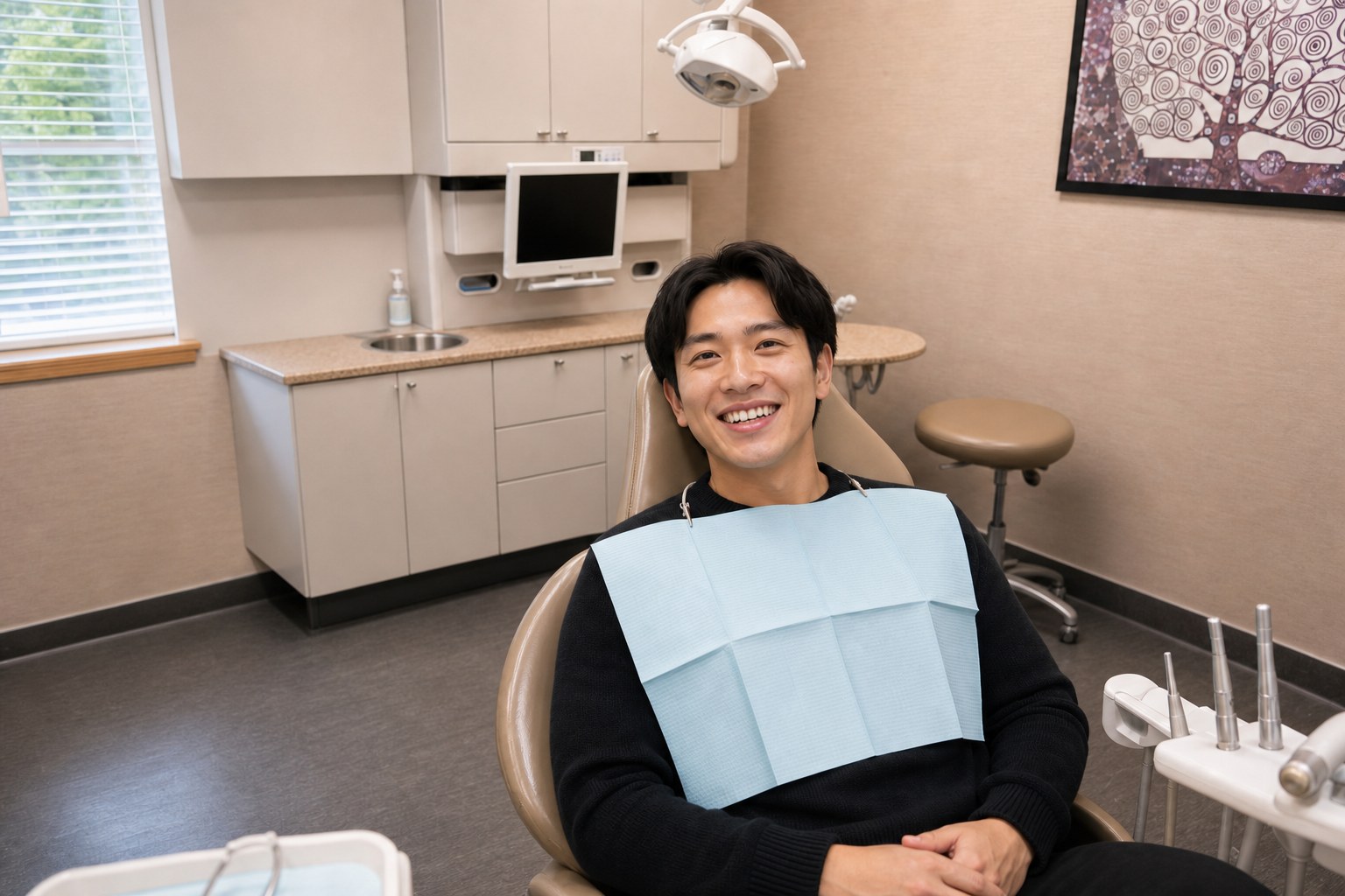 Patient smiling after knocked-out tooth repair at Hill Top Dental Group